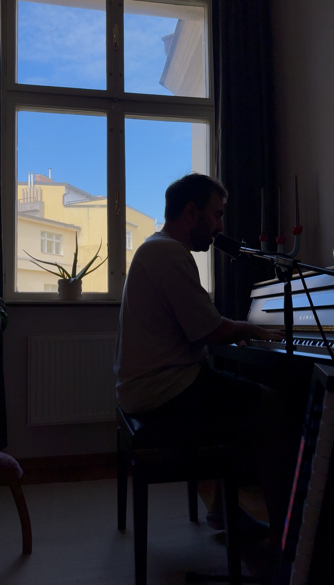 Artem making music at the piano